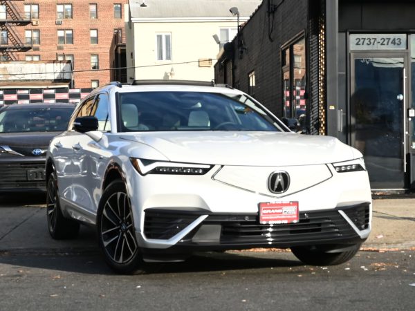 Front view of the 2024 Acura ZDX Type S with illuminated Diamond Pentagon grille and Chicane™ LED lights