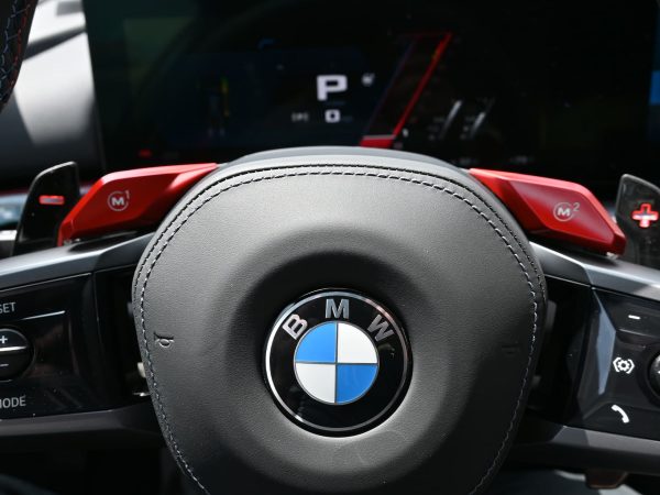 BMW M5 Hybrid in launch control mode, preparing for rapid acceleration.