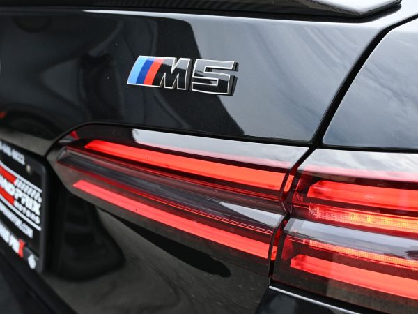 - Close-up of the BMW M5 Hybrid’s rear badging, emphasizing its electrified M identity.