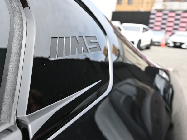 Close-up of the BMW M5 Hybrid’s Brembo® brakes and high-performance tires.