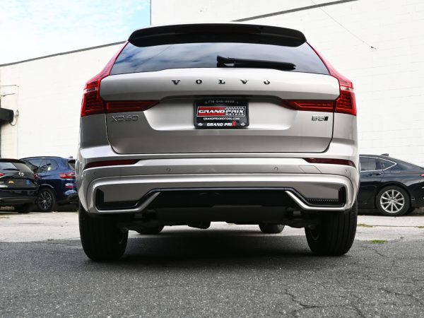 Rear three-quarter view of the 2025 Volvo XC60, emphasizing its sporty stance and LED taillights.
