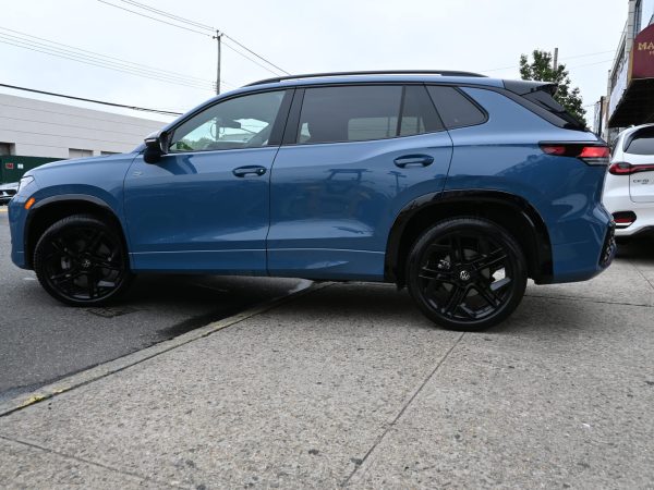 Side profile of the redesigned 2025 Tiguan highlighting aerodynamic lines and compact SUV proportions